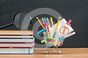School equipment with textbook on desk for back to school