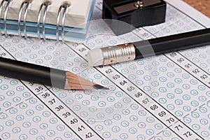 School exam answer sheet and pencil.