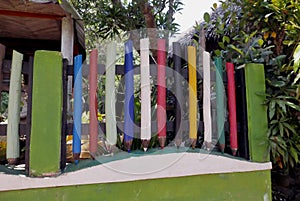 School fence in giant pencils