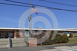 School with flag at half mast in solidarity