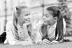 School friends formal clothes relaxing on green grass, communicative skill concept