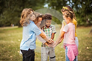 School friends will be together forever. Large group of school kids having fun in nature