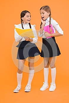 School friendship. Girl with copy books or workbooks. Study together. Knowledge day. School day. Kids cute students