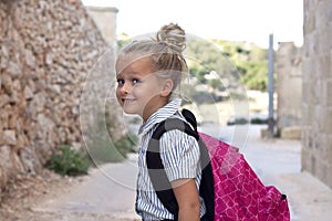 School girl with bag outside