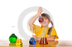 School girl doing chemistry science experiment