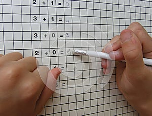 School girl with eraser and math