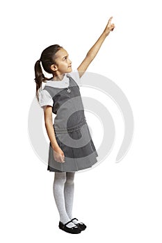 School girl pointing up smiling
