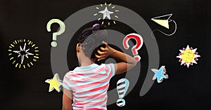 School girl and Question marks and stars drawing on blackboard