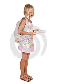 School girl reading the book