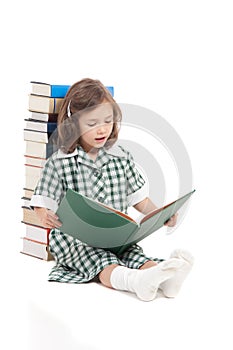 School girl reading library book