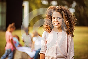 School girl standing in the park