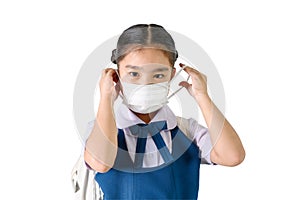 School Girl wearing mouth mask against air smog pollution on white background with clipping path