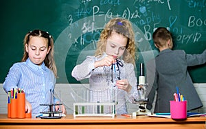 School girls study. Explore biological molecules. Future technology and science concept. Kids in classroom with