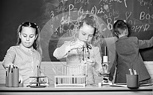 School girls study. Explore biological molecules. Future technology and science concept. Kids in classroom with