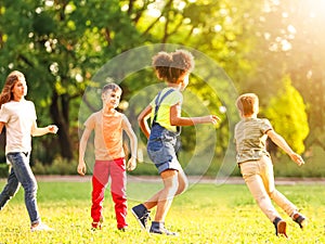 School holidays. Group of children playing outdoors