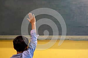 A School kid in classroom at lesson