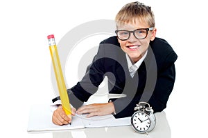 School kid finishing his assignment in time