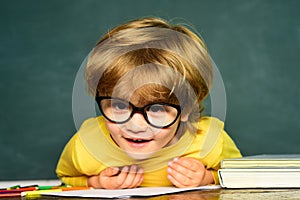 School kids against green chalkboard. Blackboard background. Educational process. School concept. Happy mood smiling