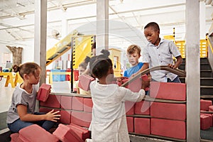 School kids building with toy bricks at a science centre