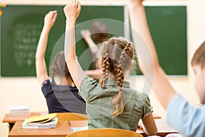 School kids in classroom at lesson