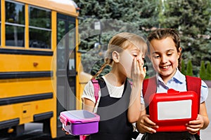 School kids eating healthy food together. schoolchildren with lunch boxes