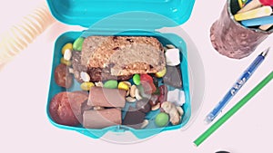 School kids lunch box sweet snacks. Blue container healthy break meal oat cookies biscuits, chocolate dragee