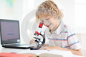 School kids with microscope. Science class