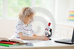 School kids with microscope. Science class