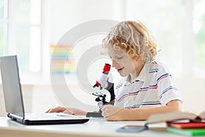 School kids with microscope. Science class