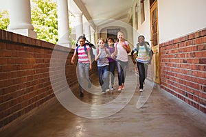 School kids running in school corridor