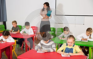 School kids studying in classroom