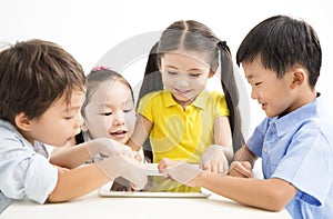 School kids studying with tablet