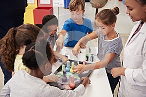 School kids taking part in experiment at science centre