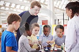 School kids taking part in a science experiment, close up