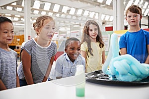 School kids watching experiment at science centre, close up