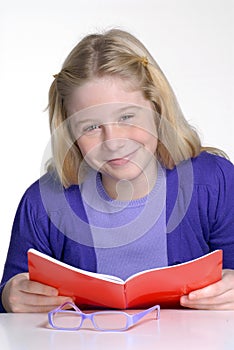 School little girl reading and studding.