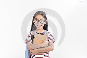 School little girl wearing a glasses carry a bag with backpack hold a books isolated on white background