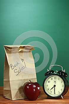 School Lunch, Apple and Clock on Desk at School