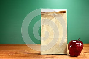 School Lunch Sack Sitting on Teacher Desk