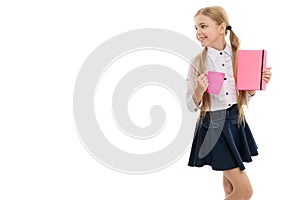 School lunch. Time to relax. Drink water. Schoolgirl with mug having tea break. Relax and recharge. Water balance