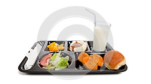 School lunch tray with food on a white backgrounf