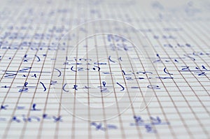 School Notebook With Handwritten Algebra Equations photo