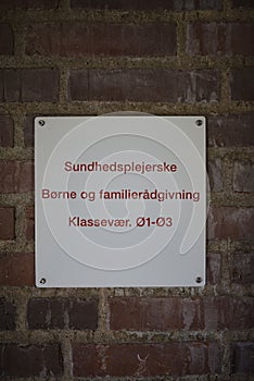 school nurse sign on school building