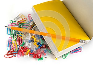 School office accessories, pencil, buttons, notepad, colorful paper clips, on a isolated  white background