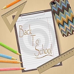 School and office supplies and empty clipboard isolated on light brown background.