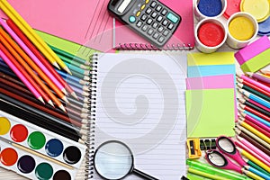 School and office supplies. school background. colored pencils, pen, pains, paper for school and student education