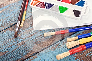 School, office supplies on a wooden background