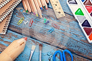 School, office supplies on a wooden background