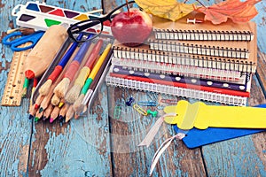 School, office supplies on a wooden background