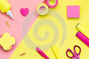 School and office supplies on a yellow-pink background